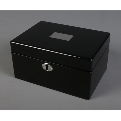 260 - A Links of London jewellery box in gloss black finish includes key