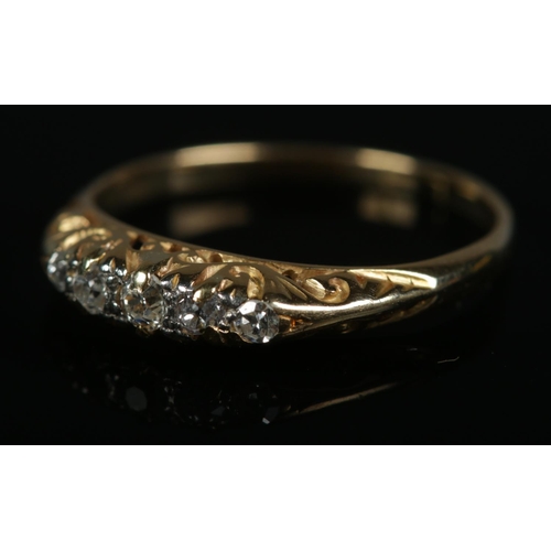 261 - An 18ct gold five stone diamond ring. Size J 1/2, 1.9g.