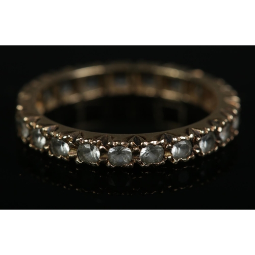 264 - A 9ct gold synthetic spinel eternity ring. Size M, 1.9g.