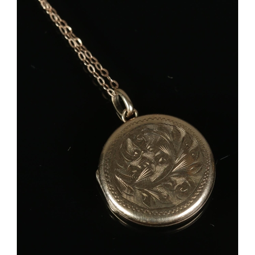 265 - A 9ct gold locket and chain featuring floral engraved decoration. 4.2g.