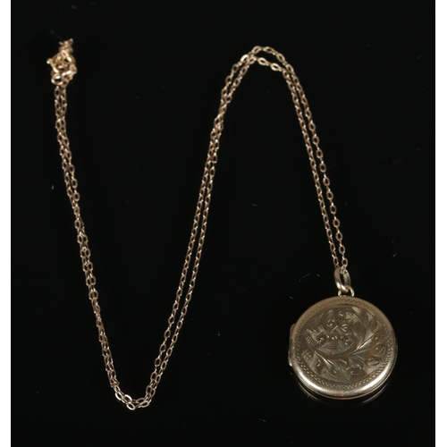 265 - A 9ct gold locket and chain featuring floral engraved decoration. 4.2g.