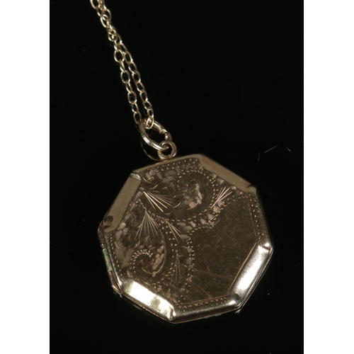 266 - A 9ct gold octagonal locket and chain. 3.2g.