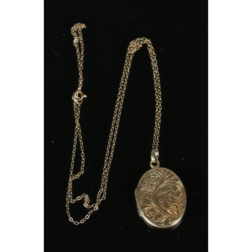 267 - A 9ct gold locket and chain featuring engraved floral motif. 3.7g.