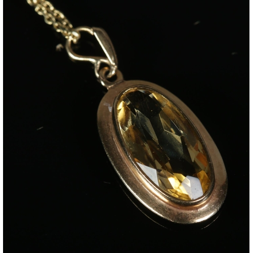 268 - A 9ct gold citrine pendant on chain. Total weight 5.6g.