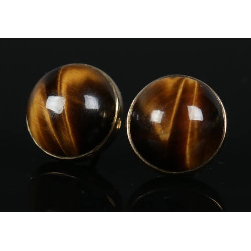 270 - A pair of 9ct gold earrings set with large Tiger's Eye stones. Total weight 4.5g