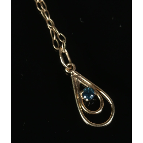 275 - A 9ct gold aquamarine pendant on chain set in teardrop shaped mount. Total weight 1g.