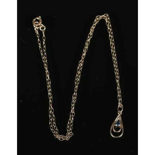 275 - A 9ct gold aquamarine pendant on chain set in teardrop shaped mount. Total weight 1g.