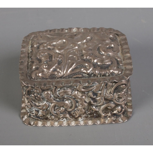 276 - A Victorian silver pin box decorated with floral motifs. Hallmarked Birmingham 1892 by Samuel Lyon, ... 