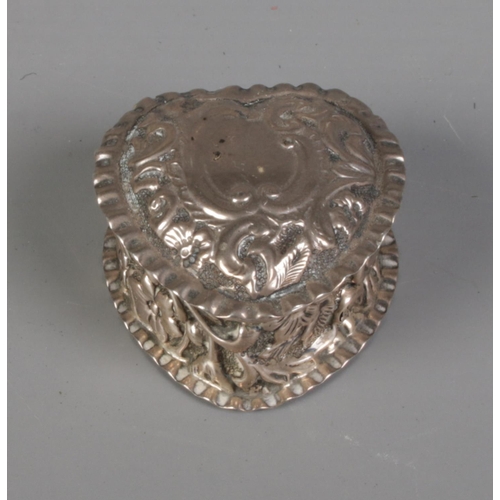 277 - A Victorian silver heart shaped pin box decorated with floral motifs. Hallmarked Birmingham 1894 by ... 