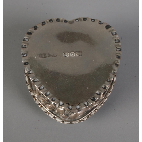 277 - A Victorian silver heart shaped pin box decorated with floral motifs. Hallmarked Birmingham 1894 by ... 