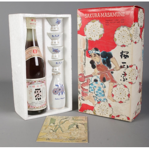 78 - Sakura-Masamune; a cased set, to include sealed 720ml bottle, sake server and four cups.