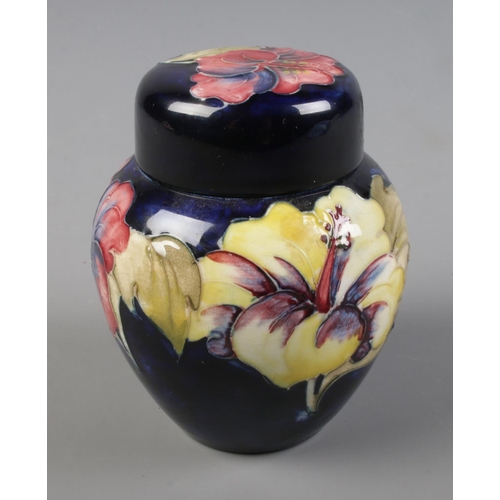 288 - A Moorcroft Pottery ginger jar in cobalt blue with hibiscus design

Hx11cm