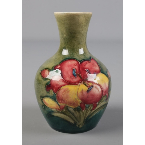 289 - A Moorcroft Pottery green hibiscus design vase.

Hx9.5cm