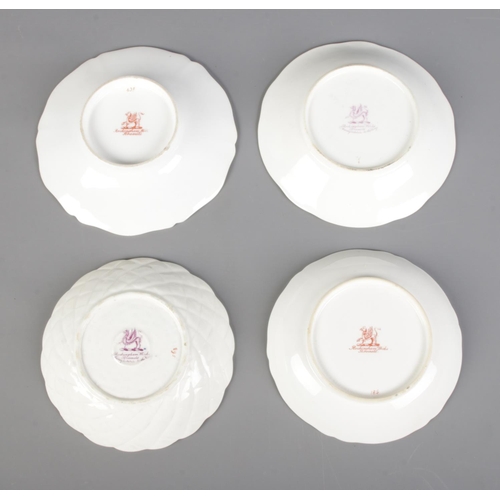 290 - A collection of four Rockingham teacup and saucers sets. Two bearing puce griffin and two bearing re... 