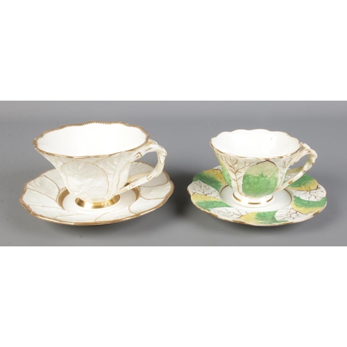 293 - Two Primrose Leaf Rockingham teacups and saucers featuring decorative twisted handles. Pattern numbe... 