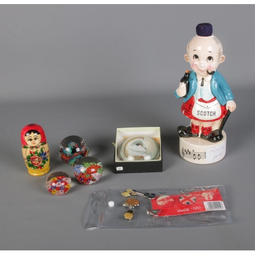 86 - A quantity of collectables to include glass paperweights, Scotch musical decanter, Russian doll and ... 