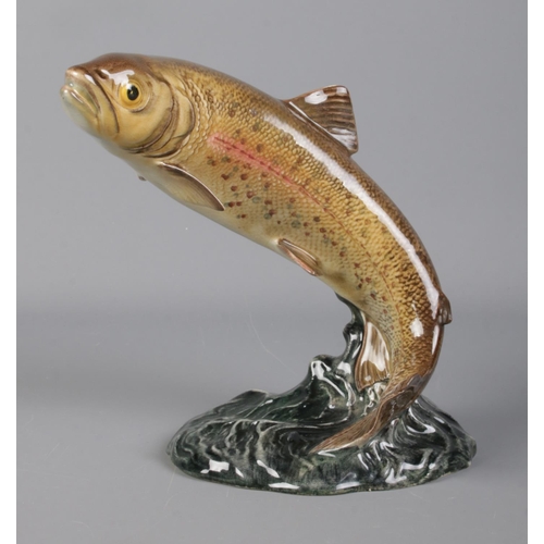 296 - A Beswick ceramic model of a leaping trout; No. 1032. 16cm high.