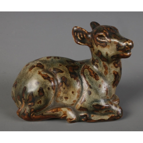 308 - A Royal Copenhagen stoneware figure formed as a recumbent deer. Possibly by  Knud Kyhn. (7cm x 10cm)