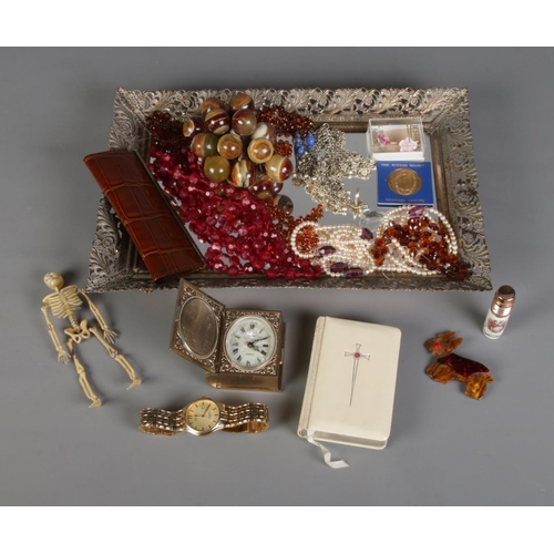 96 - A gilt framed dressing table tray with contents of costume jewellery and collectables. To include Eu... 