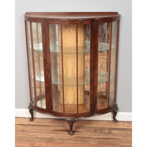 311 - A mahogany bow front China cabinet raised on cabriole legs. Approx. dimensions 90cm x 110cm x 30cm.