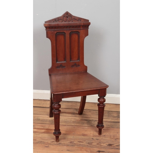 316 - A Victorian carved mahogany hall chair.