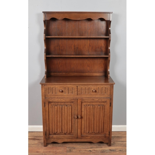 322 - A mid 20th century oak dresser.

Hx178cm
Wx95cm
Dx44cm