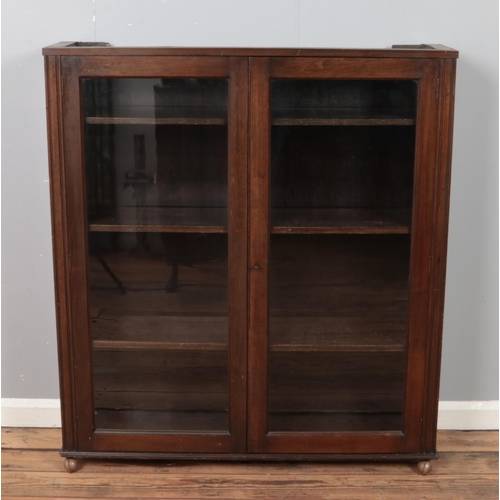 324 - Dark oak two door glazed bookcase cabinet. 

Hx124cm
Wx110cm
Dx29cm