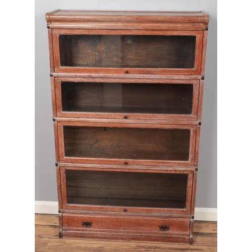 358 - An oak Globe Wernicke four section stacking bookcase. (142cm x 86cm)