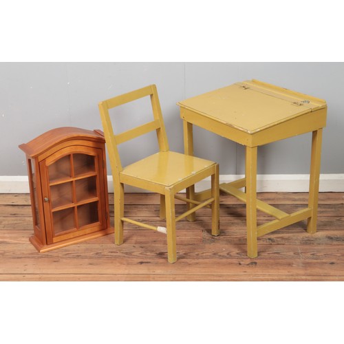 328 - A child school desk and chair with small display cabinet