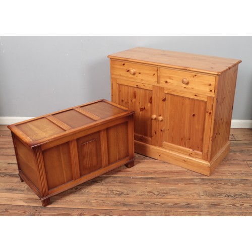 327 - A modern pine cupboard along with earlier blanket box

Cupboard measuring 
Hx89cm
Wx108cm
Dx52cm