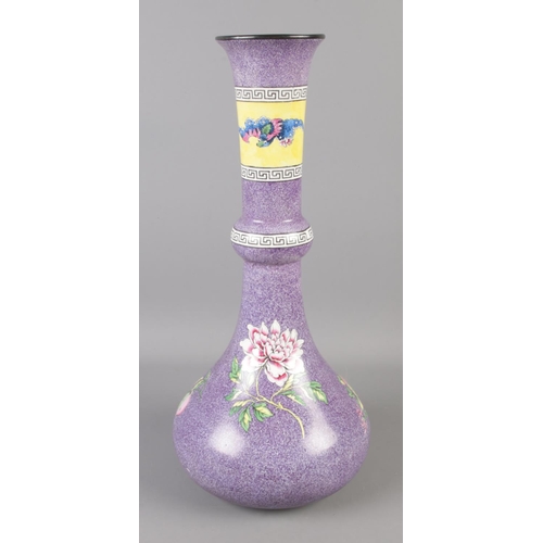 132 - A Bishop and Stonier large purple glaze vase. Decorated with flowers, mythical beast and Greek key b... 