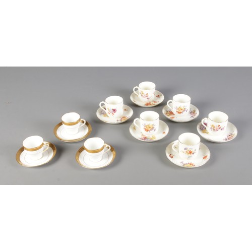 133 - A collection of Davis Collamore & Co for Minton tea cups and saucers featuring gilt decoration. Incl... 