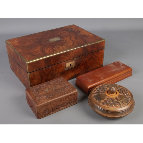 124 - Four wooden boxes. Includes walnut example with brass inlay, etc.