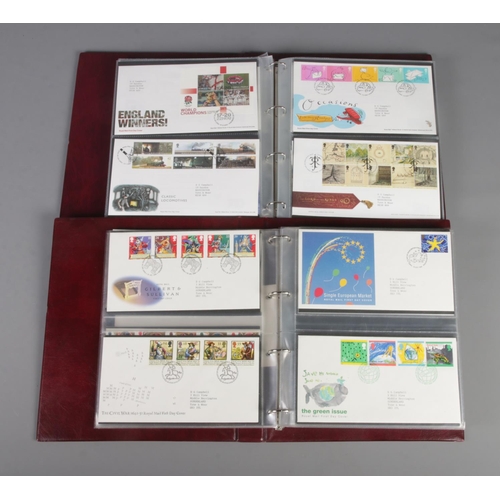 16 - Two albums of mostly British Royal Mail First Day Covers along with selection of Netherlands example... 