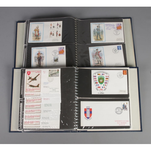24 - Two albums of military first day covers to include British Military Uniforms, Royal Air Force and Ro... 