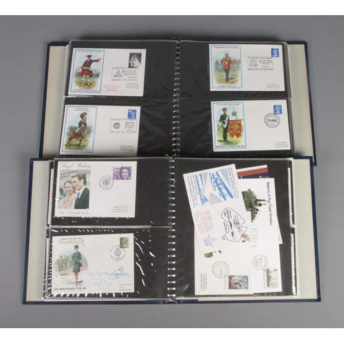 24 - Two albums of military first day covers to include British Military Uniforms, Royal Air Force and Ro... 