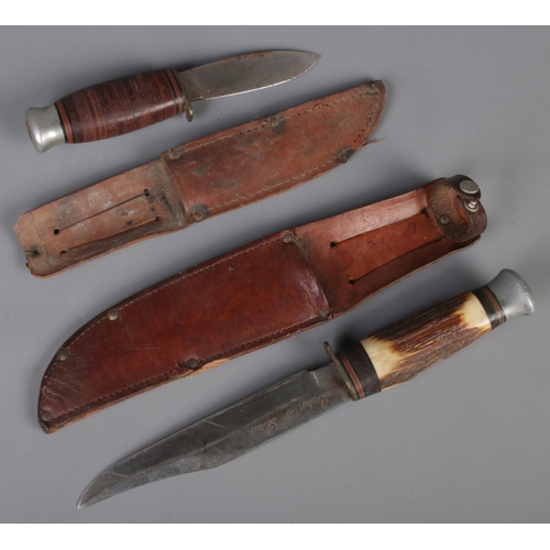 45 - Two hunting knives with leather sheath. Includes horn handled example, etc. CANNOT POST OVERSEAS.
