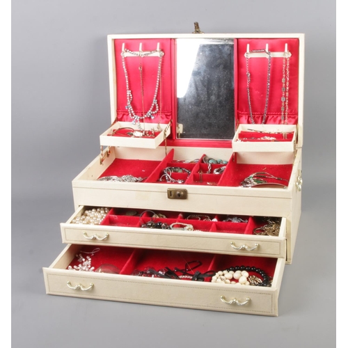 6 - A large Mele cantilever jewellery box with contents of costume jewellery. To include necklaces, simu... 
