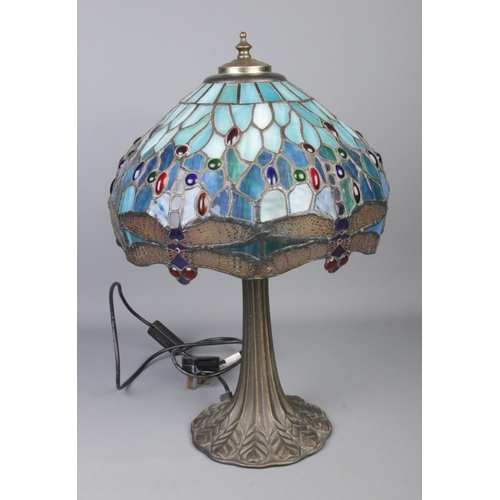 73 - A Tiffany style lamp and shade featuring blue dragonfly design.