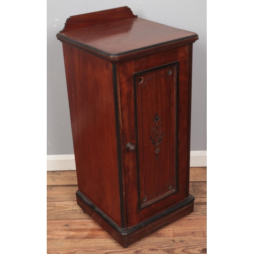 411 - A Victorian carved mahogany bedside cabinet. (93cm x 42cm)