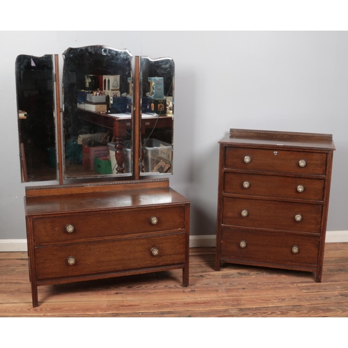 413 - A three-piece oak and ply bedroom suite, comprising of mirrored wardrobe, chest of drawers and mirro... 