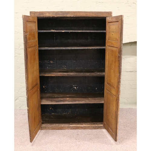 416 - A Victorian pine linen cupboard, with paneled front doors and shelved interior. Height: 164cm, Width... 