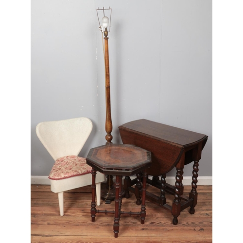 426 - Four pieces of furniture. Includes oak drop leaf table, turned standard lamp, octagonal window table... 