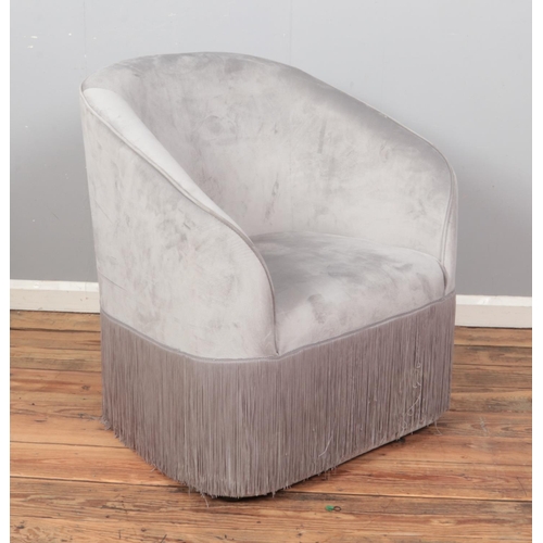 431 - A tub arm chair upholstered in grey velvet.