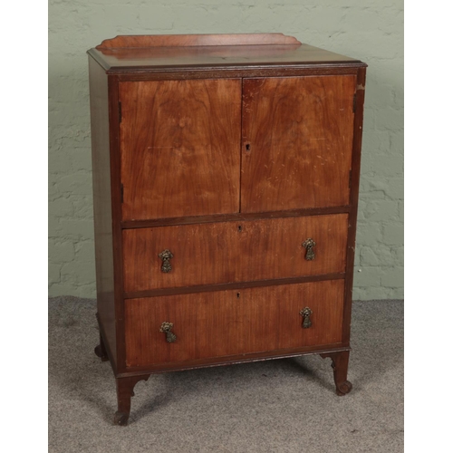 512 - A vintage mahogany cabinet with two doors over two drawers 

Hx104cm
Wx70cm
Dx44cm