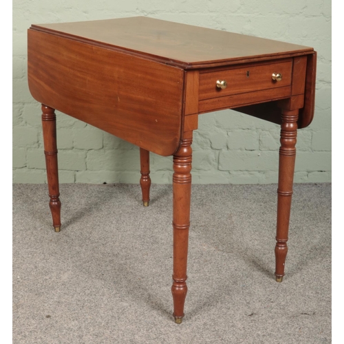 530 - A Victorian mahogany Pembroke table raised on turned supports. (67cm x 76cm x44cm)