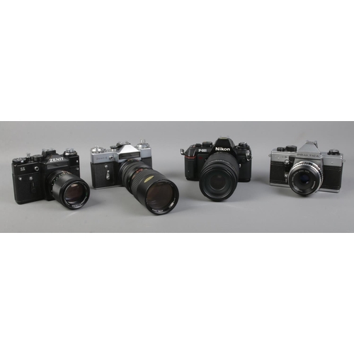 105 - Four cameras; Nikon F-301 with Sigma Auto Focus, Zenit-E with large Optomax 85-205mm, Praktica MTL5B... 