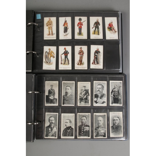 11 - Two albums of incomplete cigarette card sets mostly military examples by Gallaher and Will's includi... 