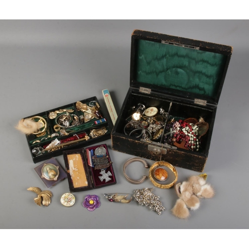 113 - A jewellery box filled with various pieces inlcuding brooches, necklaces, watches, medals etc