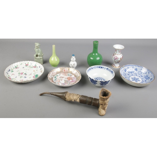 115 - A quantity of mostly oriental ceramics. Includes Celadon dog of fo, blue & white tea bowl, Cantonese... 